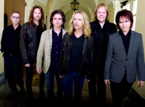 MACON, GA - OCTOBER 04: Rock Group STYX L/R: Chuck Panozzo, Ricky Phillips, Todd Sucherman, Tommy Shaw, James "J.Y." Young and Lawrence Gowan. Portrait shoot at Macon City Auditorium on October 4, 2014 in Macon, Georgia. (Photo by Rick Diamond/Getty Images for STYX)